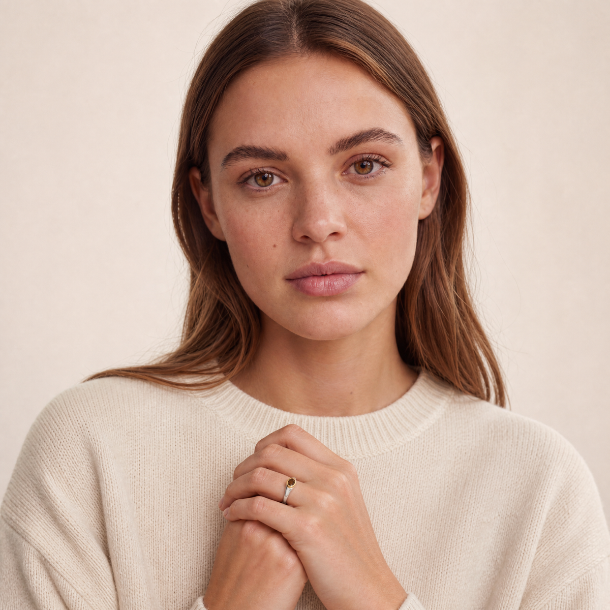 April Brown Diamond Birthstone Ring worn on hand, model Jenny in cream knit - Golden Horn Jewellery