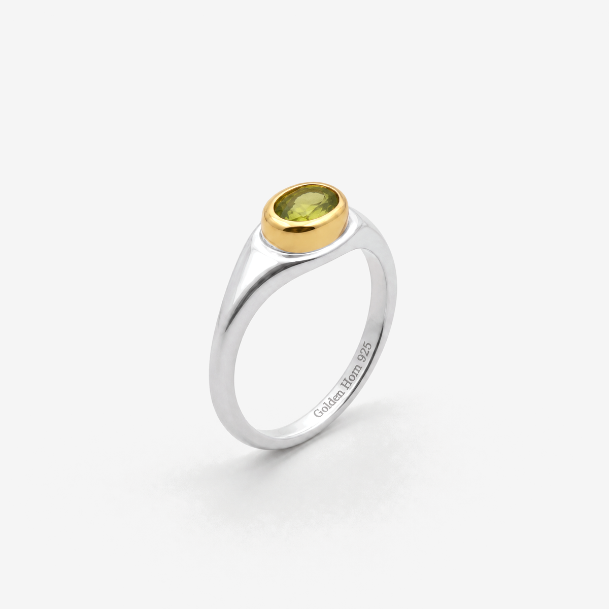 August Peridot Birthstone Ring in sterling silver with gold bezel, three-quarter view - Golden Horn Jewellery