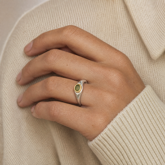 August Peridot Birthstone Ring close-up on hand, peridot in gold bezel - Golden Horn Jewellery