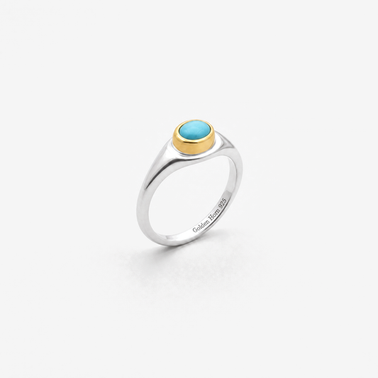 December Turquoise Birthstone Ring in sterling silver with gold bezel, three-quarter view - Golden Horn Jewellery