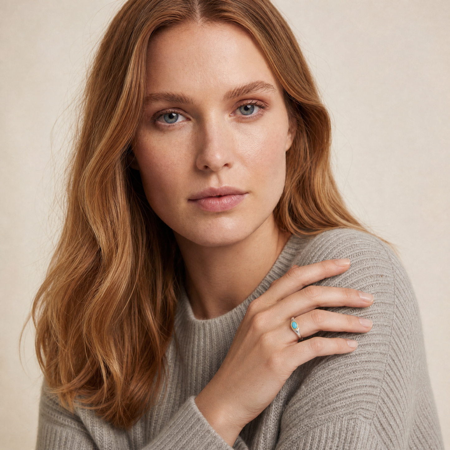 December Turquoise Birthstone Ring worn on hand, model Serena in grey knit - Golden Horn Jewellery