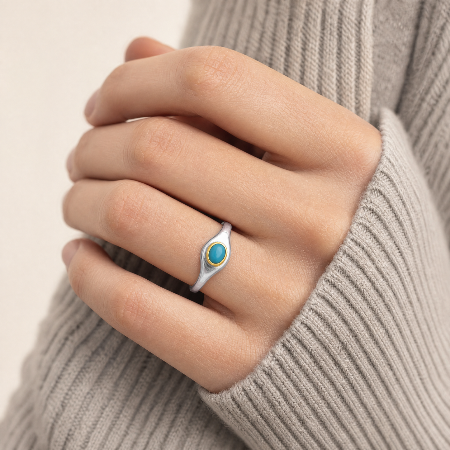 December Turquoise Birthstone Ring close-up on hand, turquoise cabochon in gold bezel - Golden Horn Jewellery