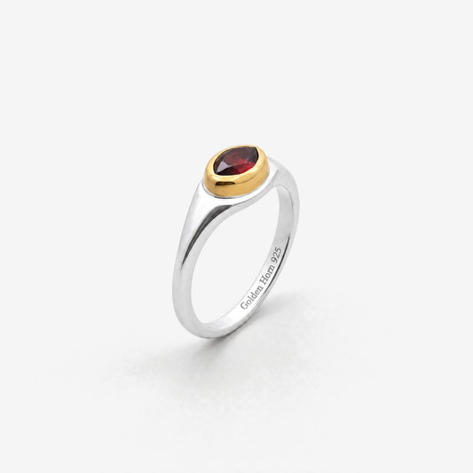 January Garnet Birthstone Ring in sterling silver with gold bezel, three-quarter view - Golden Horn Jewellery