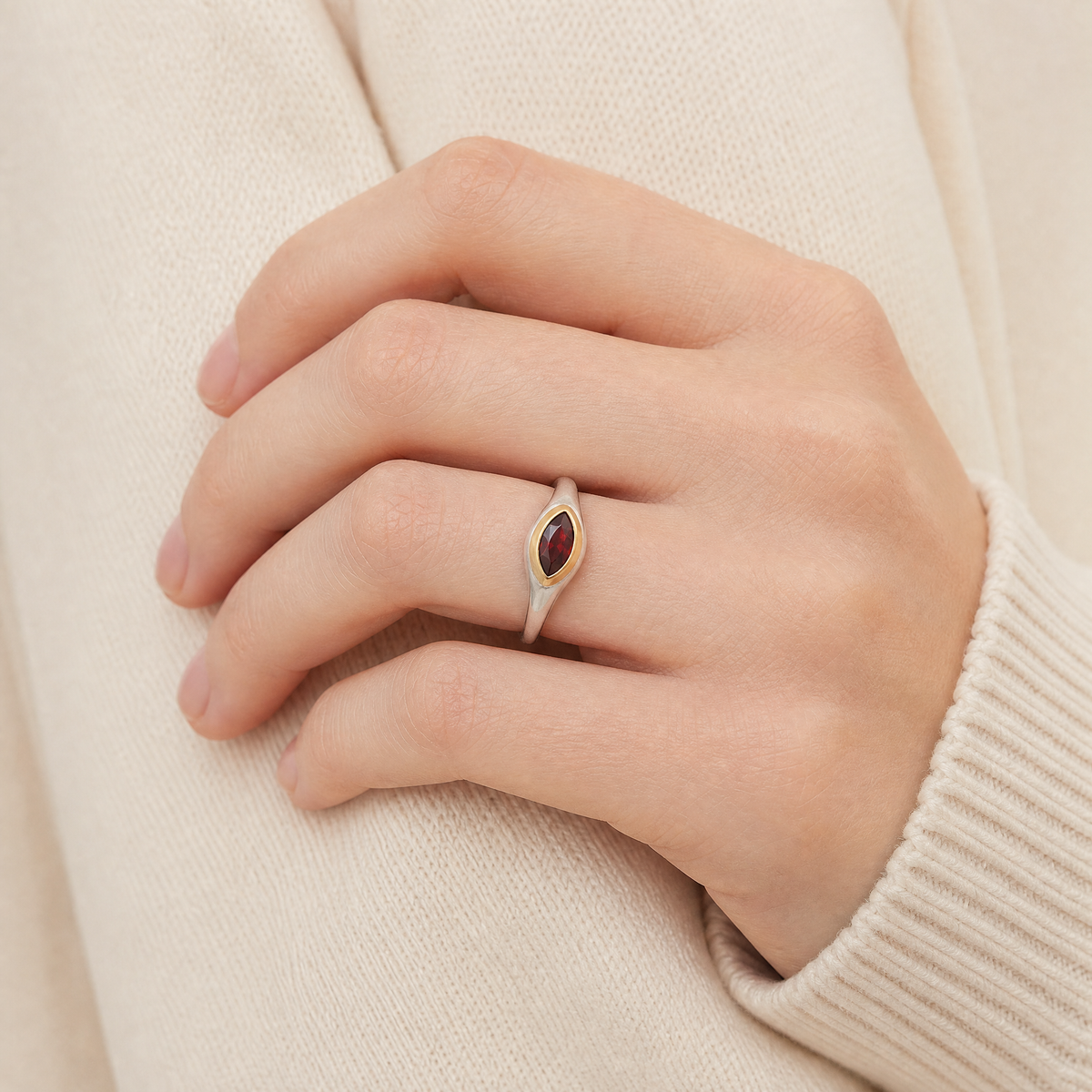 January Garnet Birthstone Ring close-up on hand, garnet in gold bezel - Golden Horn Jewellery