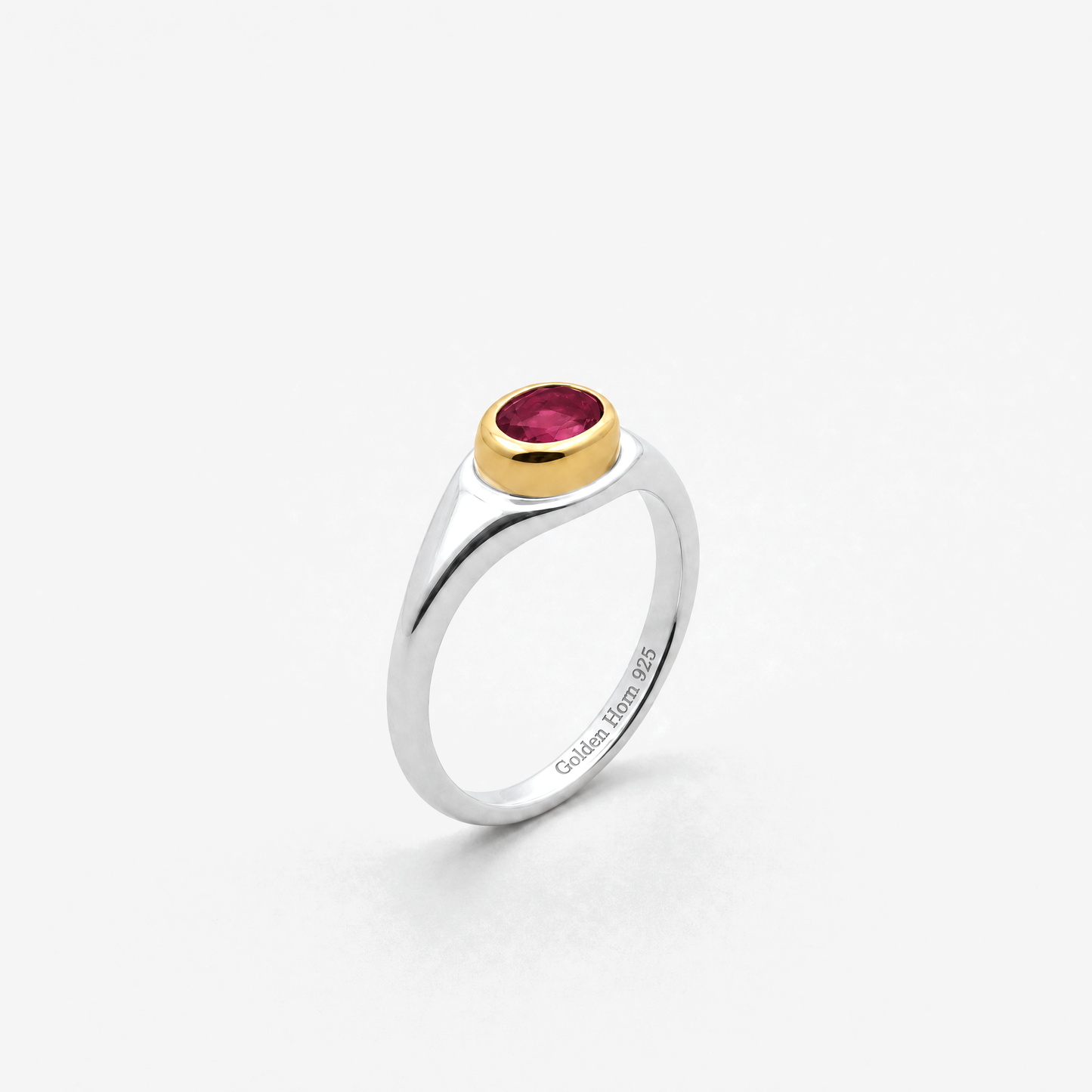 July Ruby Birthstone Ring in sterling silver with gold bezel, three-quarter view - Golden Horn Jewellery
