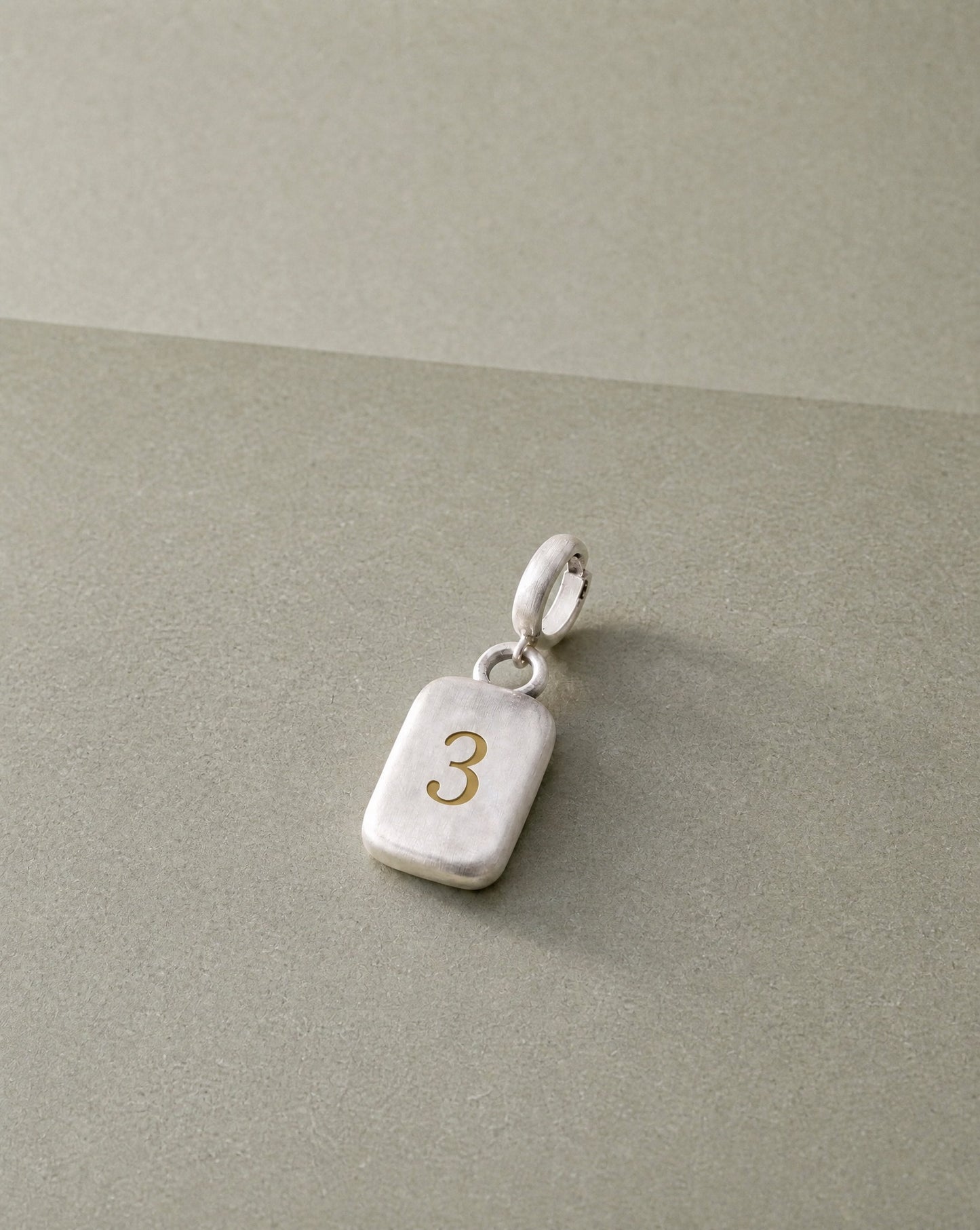 Number 3 Numerology Pendant still life – Golden Horn Jewellery