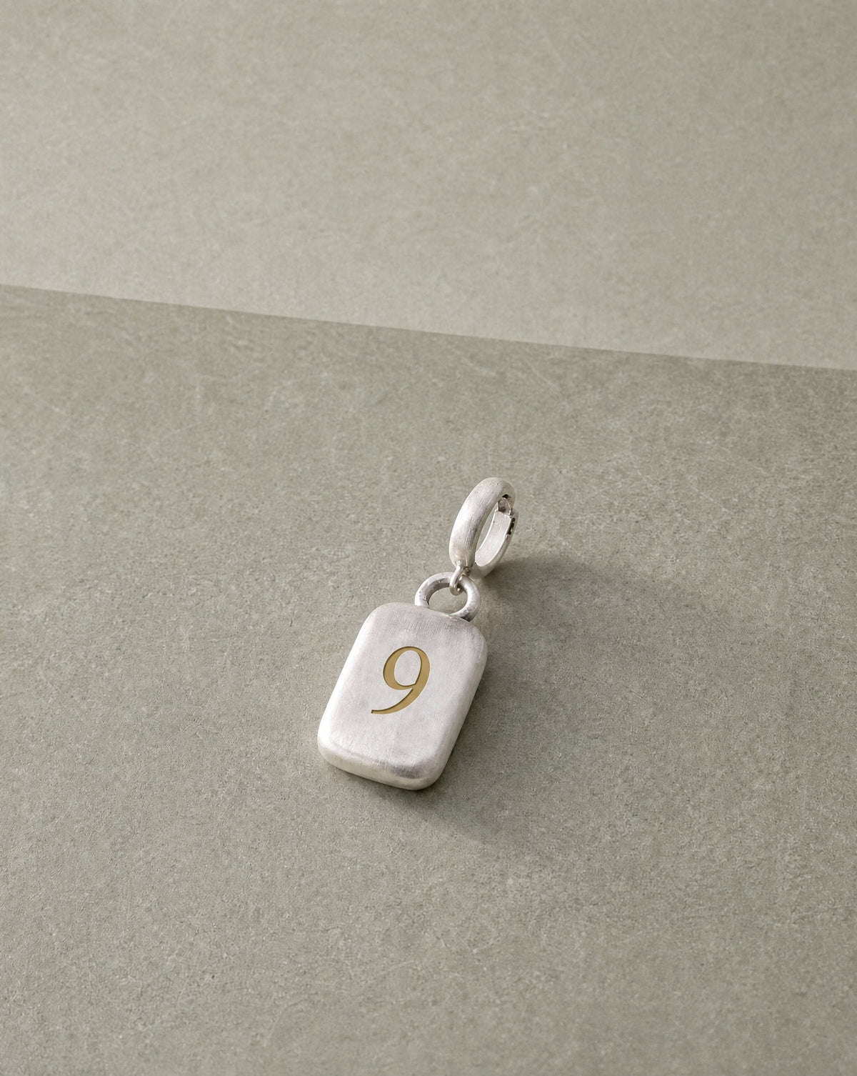 Number 9 Numerology Pendant still life – Golden Horn Jewellery