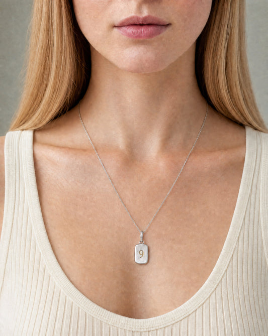 Number 9 Numerology Pendant worn, close-up – Golden Horn Jewellery
