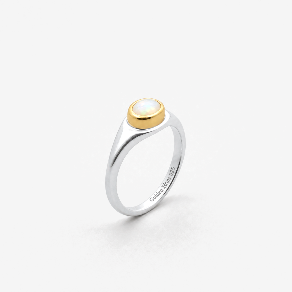 October Opal Birthstone Ring in sterling silver with gold bezel, three-quarter view - Golden Horn Jewellery