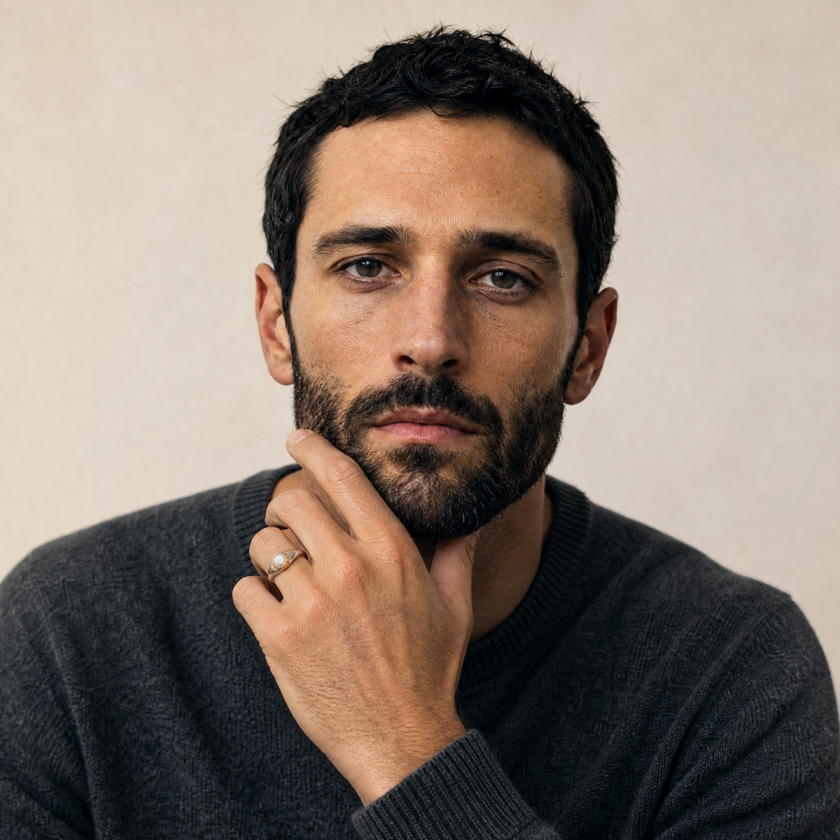 October Opal Birthstone Ring worn on hand, model Marco in charcoal knit - Golden Horn Jewellery