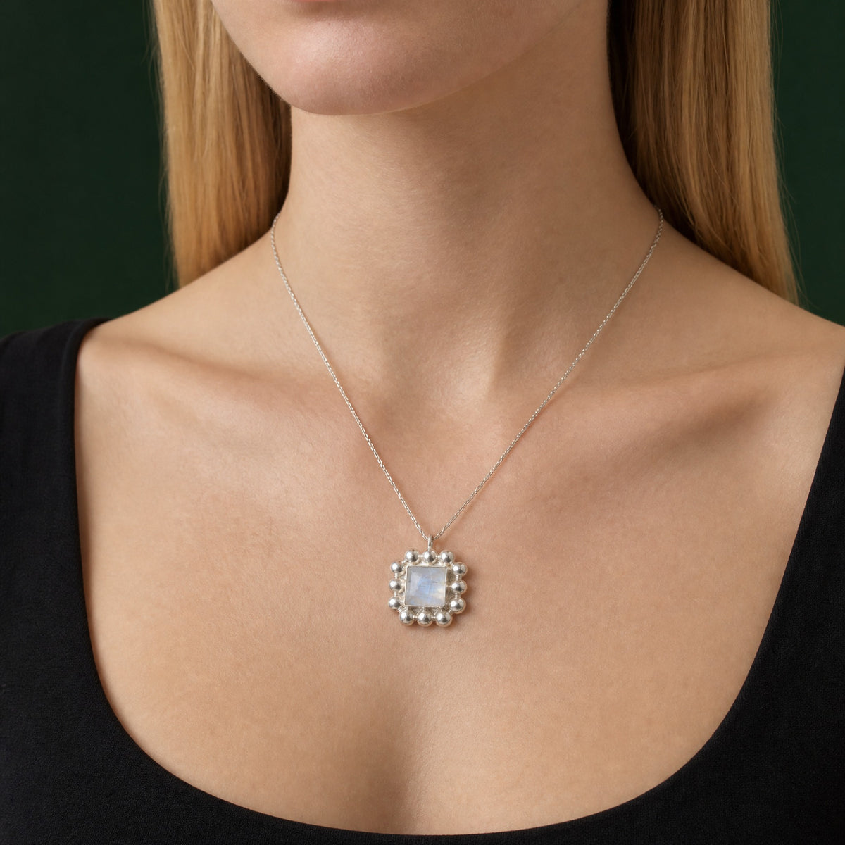 Soap And Bubble Moonstone Silver Pendant close-up on model – Golden Horn Jewellery