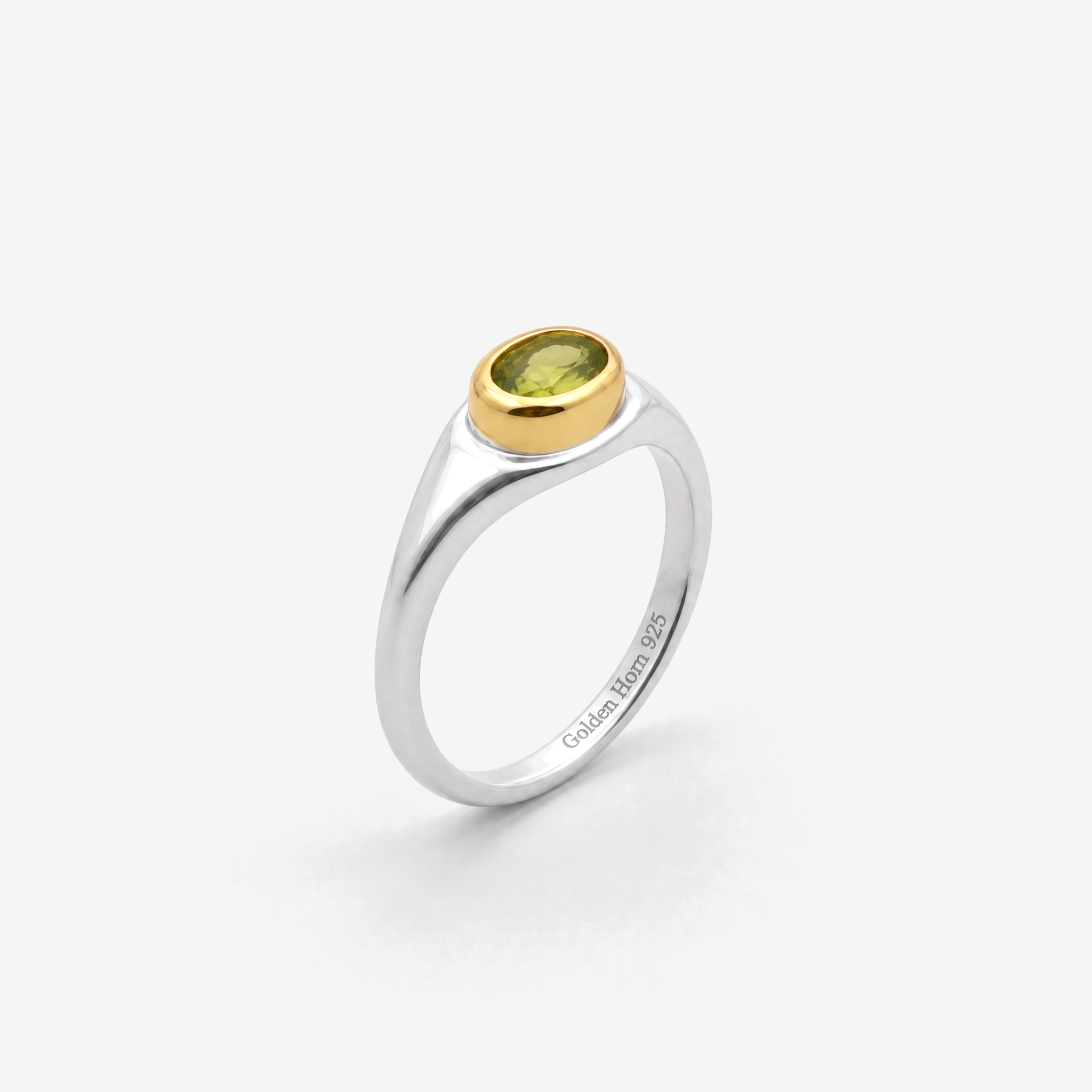 August Peridot Birthstone Ring in sterling silver with gold bezel, three-quarter view - Golden Horn Jewellery