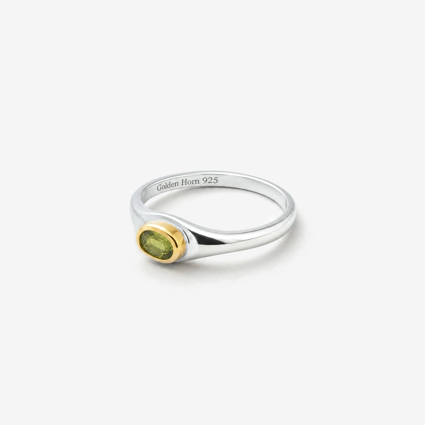 August Peridot Birthstone Ring lying flat, peridot in raised gold bezel - Golden Horn Jewellery