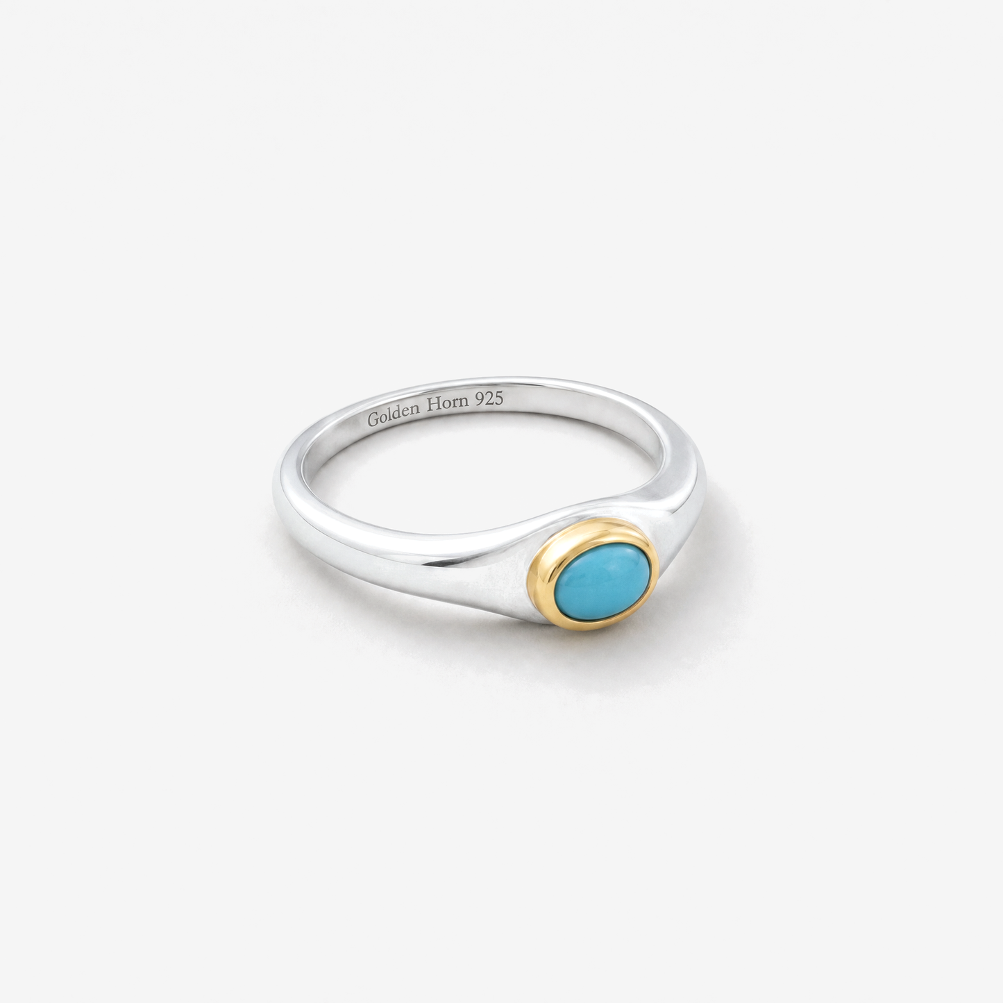 December Turquoise Birthstone Ring lying flat, turquoise cabochon in raised gold bezel - Golden Horn Jewellery