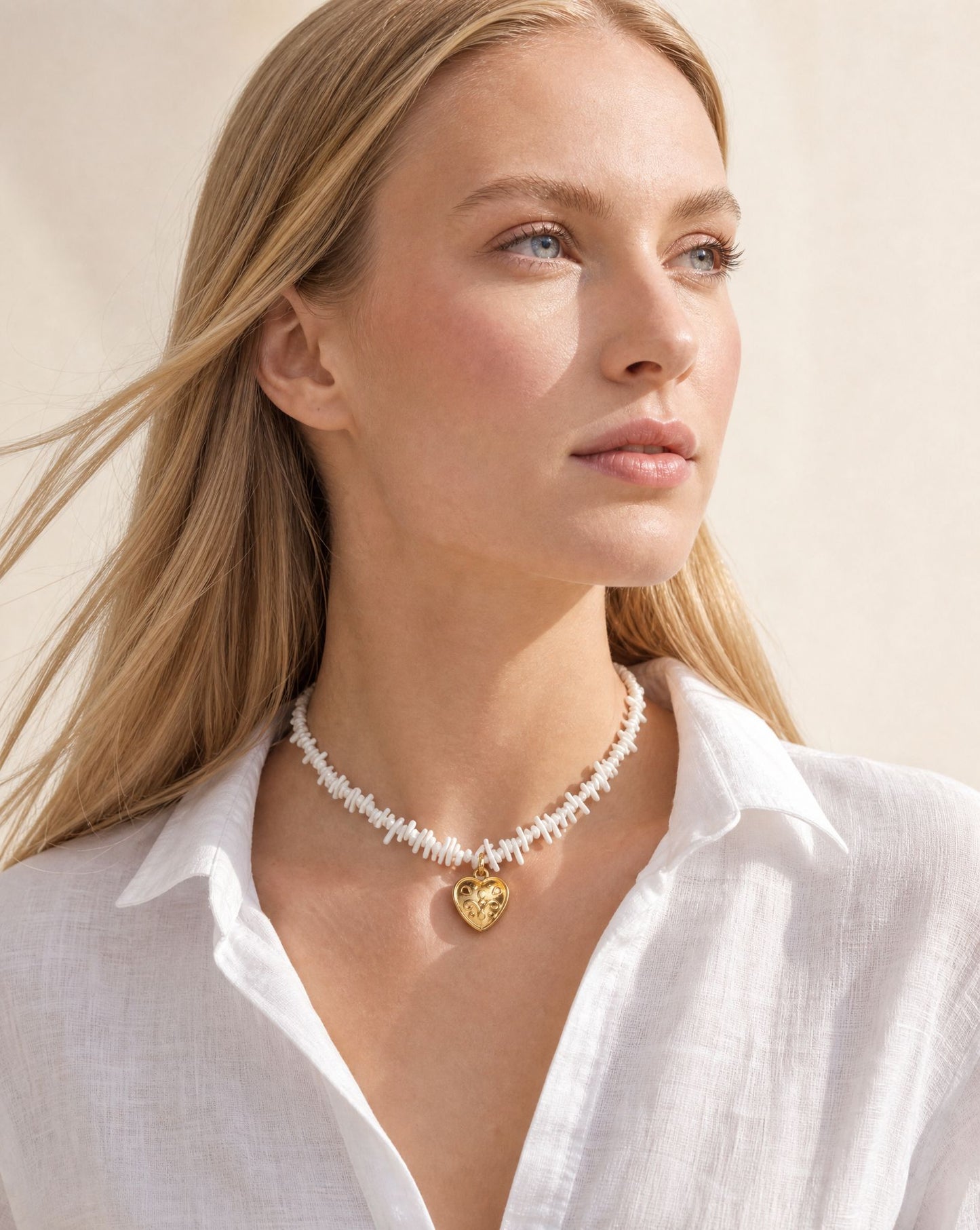 Coral Heart Necklace worn, profile view – Golden Horn Jewellery