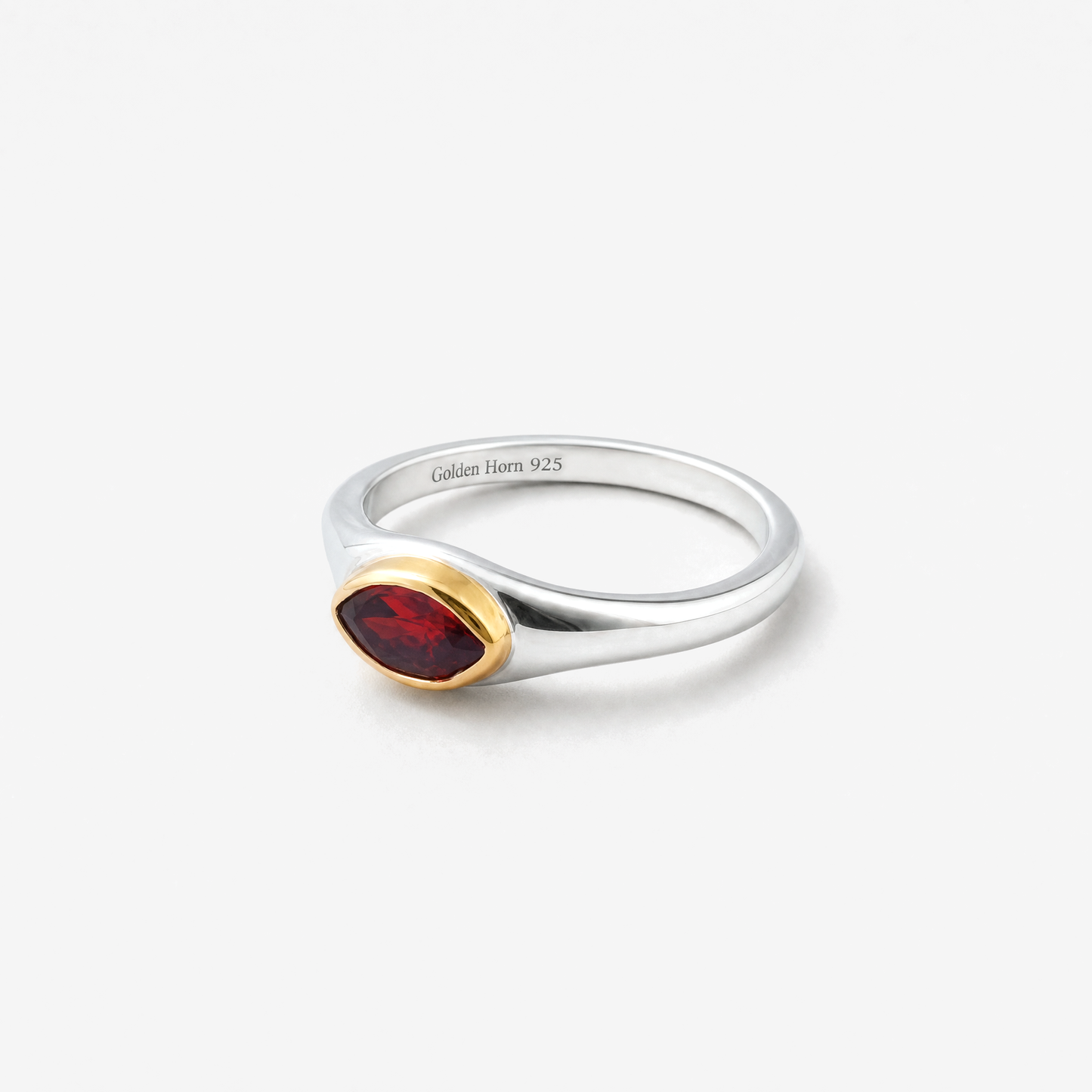 January Garnet Birthstone Ring lying flat, marquise garnet in raised gold bezel - Golden Horn Jewellery