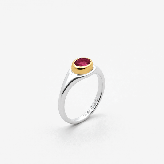 July Ruby Birthstone Ring in sterling silver with gold bezel, three-quarter view - Golden Horn Jewellery