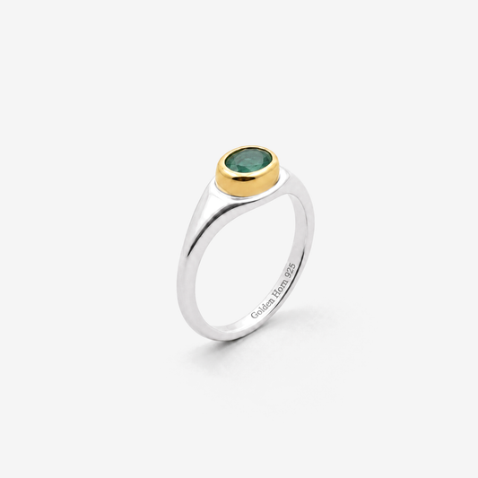 May Emerald Birthstone Ring in sterling silver with gold bezel, three-quarter view - Golden Horn Jewellery