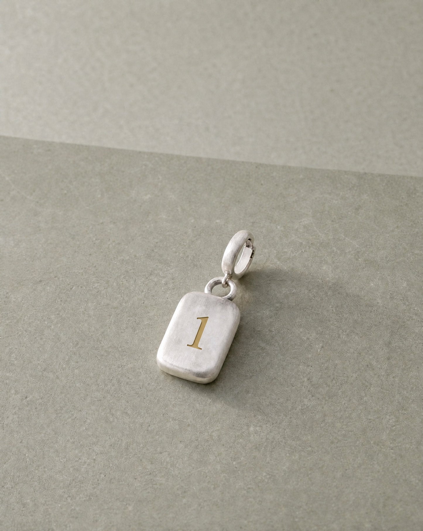 Number 1 Numerology Pendant still life – Golden Horn Jewellery