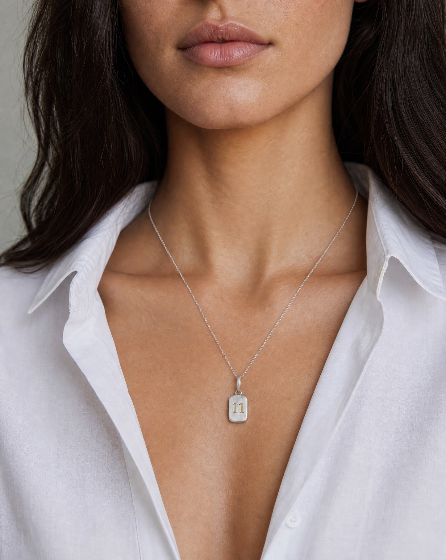 Number 11 Numerology Pendant worn, close-up – Golden Horn Jewellery