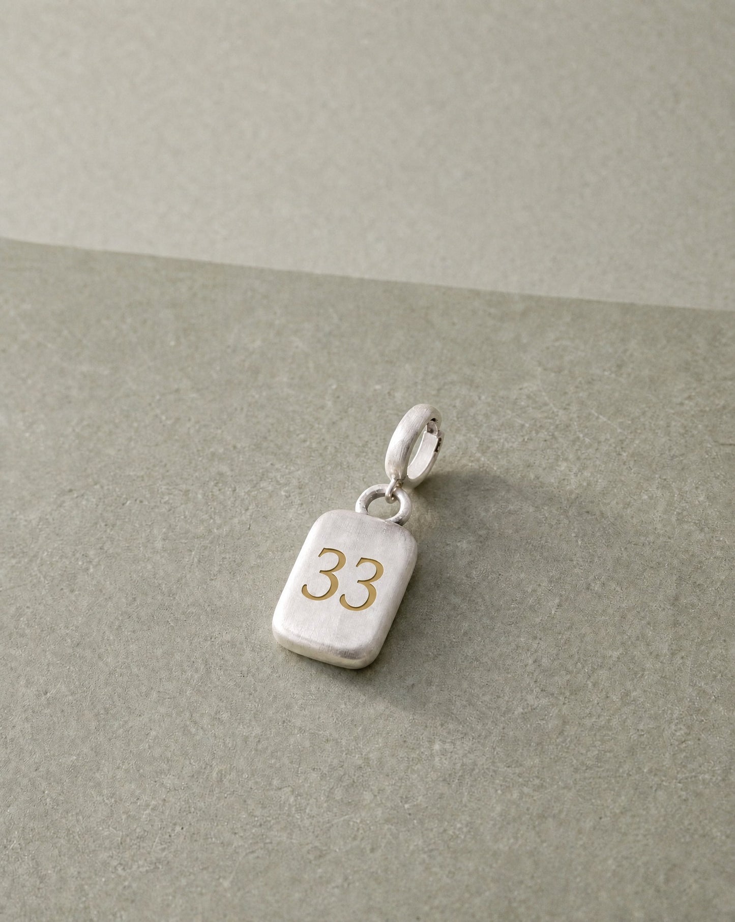 Number 33 Numerology Pendant still life – Golden Horn Jewellery