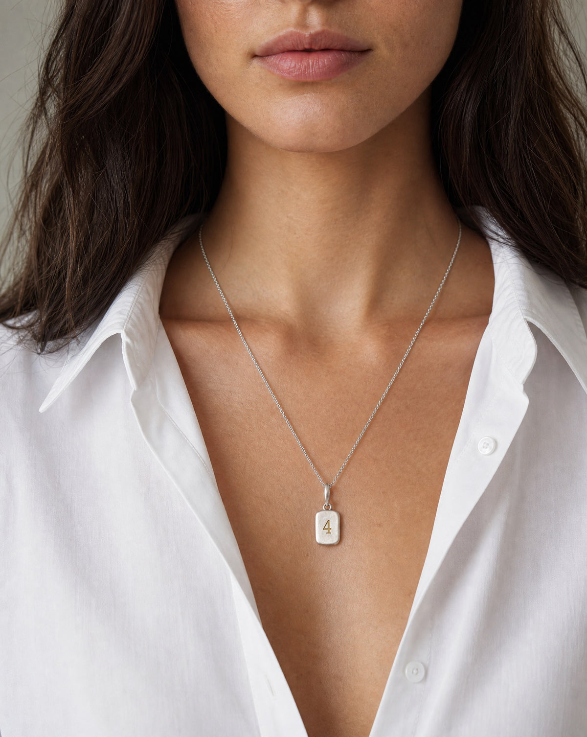 Number 4 Numerology Pendant worn, close-up – Golden Horn Jewellery
