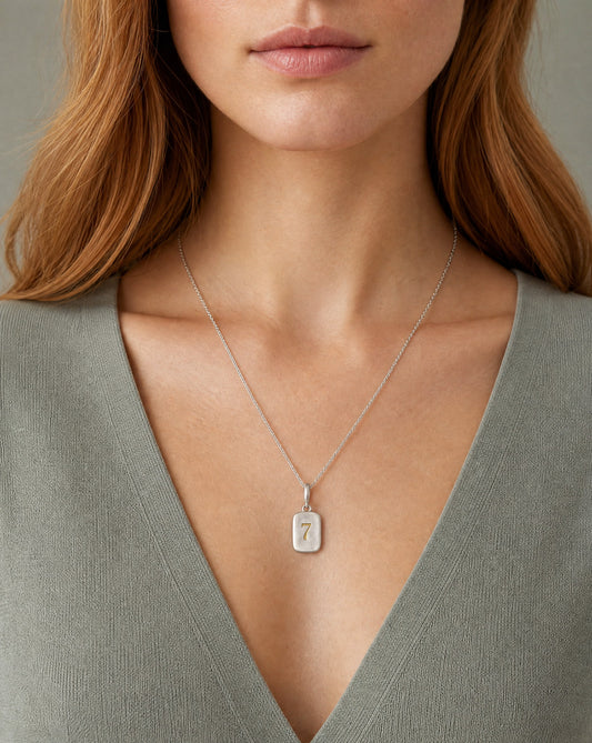 Number 7 Numerology Pendant worn, close-up – Golden Horn Jewellery