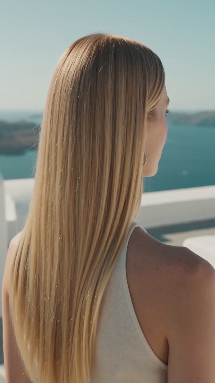 Double Lock Circle Silver Drop Earrings worn by a model on an Aegean terrace