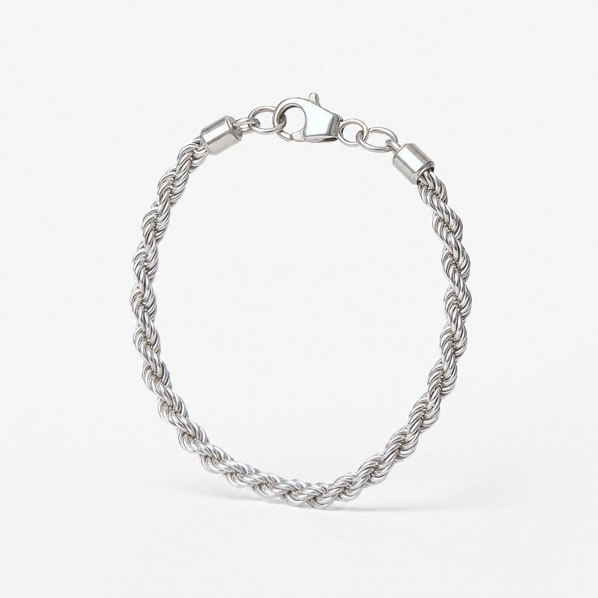 Silver Rope Chain Bracelet standing upright, showing the thick twisted rope links and lobster clasp – Golden Horn Jewellery