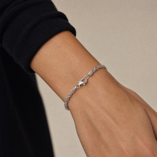 Close-up of the Silver Rope Chain Bracelet worn on a wrist with a black turtleneck sleeve – Golden Horn Jewellery