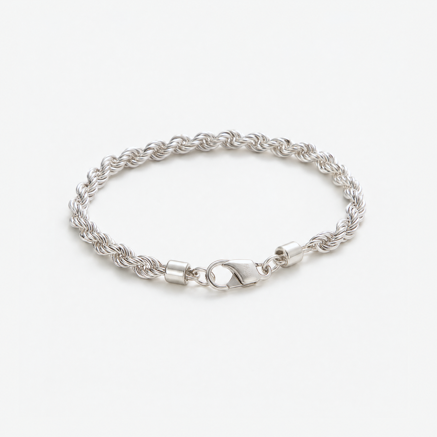 Silver Rope Chain Bracelet in a loose coil, three-quarter view – Golden Horn Jewellery